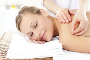 Radiant woman receiving an acupuncture treatment in a health spa